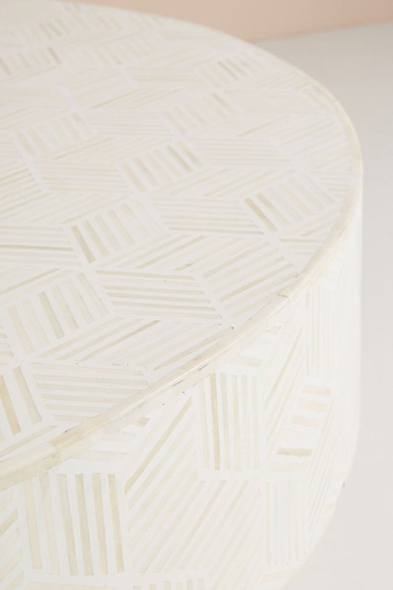 White Round Cocktail Table with bone inlay and brass base, shown in a close-up view of the patterned tabletop.