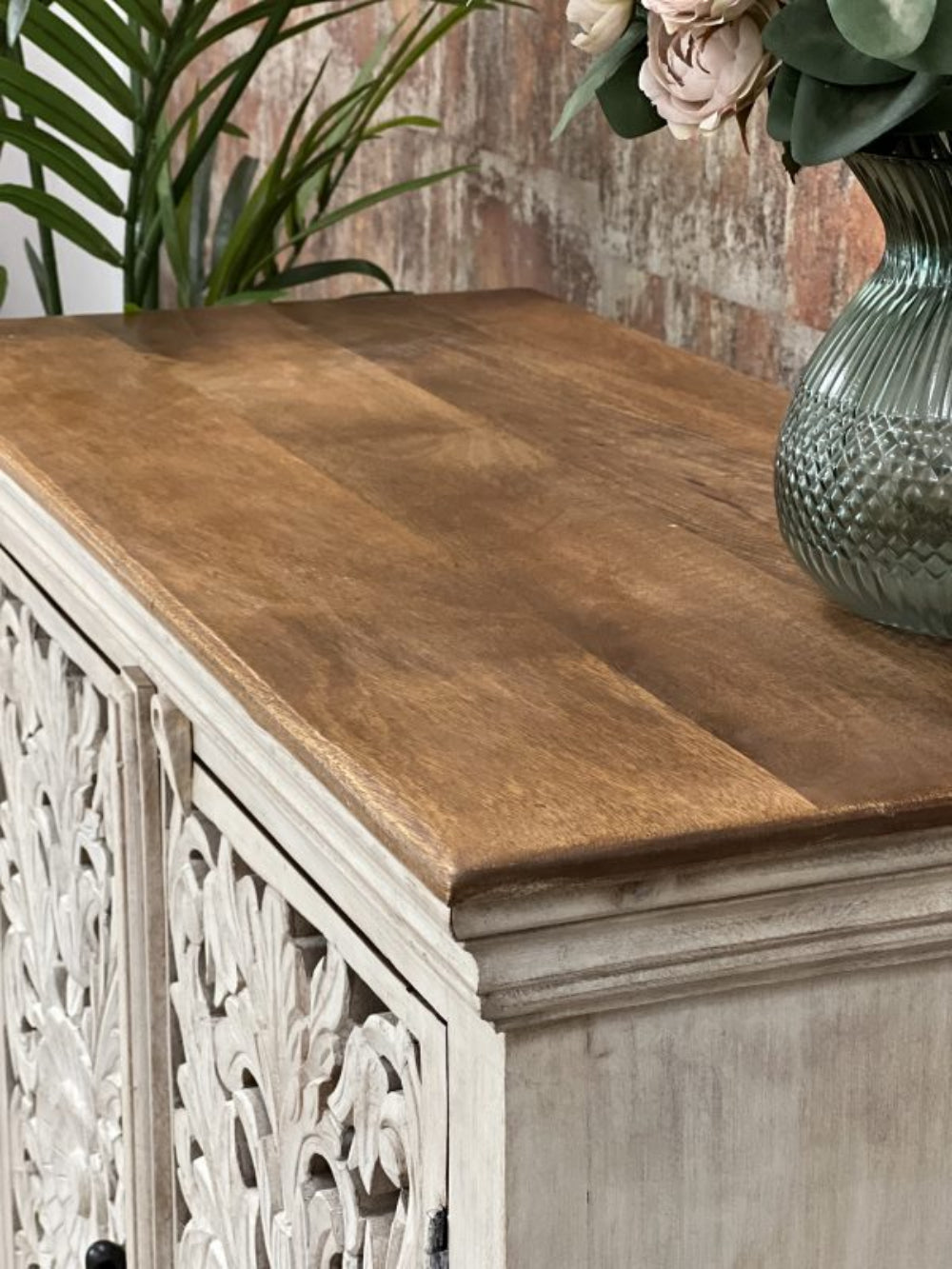 Wood top carved credenza with a rustic finish, corner detail view showing the natural wood grain and molded trim.