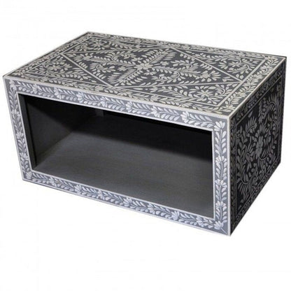 Bone inlay living room coffee table in charcoal grey with intricate white floral inlay across the top and all sides, open storage shelf below, handcrafted from solid mango wood