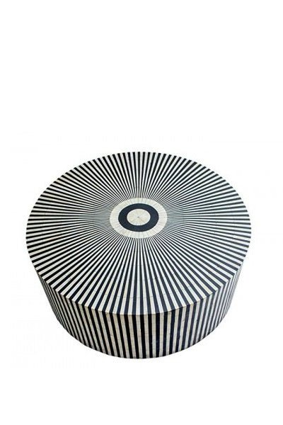Round black and white bone inlay coffee table with optical sunburst pattern and recessed base on a white background.