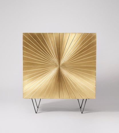 hand embossed gold clad cabinet with sunbrust design