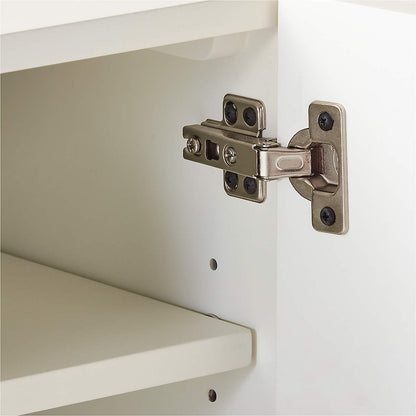 Detail shot inside the bone inlay carreau media console showing a precision nickel cabinet hinge mounted on a clean ivory interior shelf. Reveals the quality joinery, adjustable wooden shelf system, and durable hardware used in the handcrafted construction of this luxury bone inlay entertainment unit.