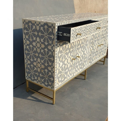 Grey bone inlay storage sideboard with open drawer revealing interior depth, four-door cabinet and brushed gold metal legs