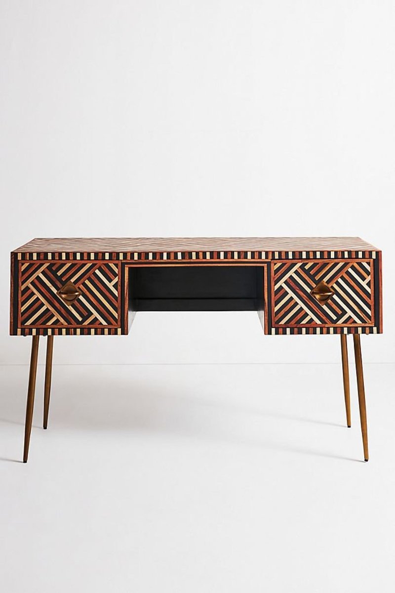 Handmade walnut bone inlay laptop desk shown in a straight-on front view, with warm walnut inlay across the desktop and two drawer fronts, brass handles, slim tapered legs, and a light studio background.