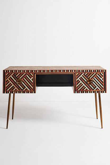 Handmade walnut bone inlay laptop desk shown in a straight-on front view, with warm walnut inlay across the desktop and two drawer fronts, brass handles, slim tapered legs, and a light studio background.
